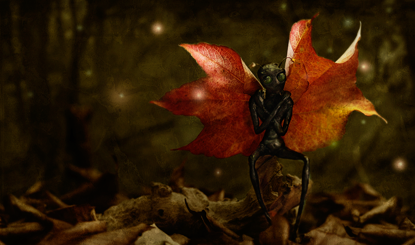A dark autumn fairy with huge red leaves wings is sitting on a branch, surrounded by red and brown leaves and fireflies in the air - Sculpture and surreal photomanipulation